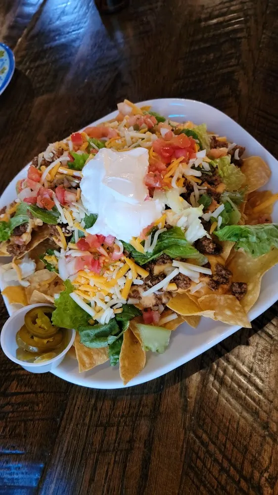 Head Nachos with Seasoned Beef Add Shredded Cheese